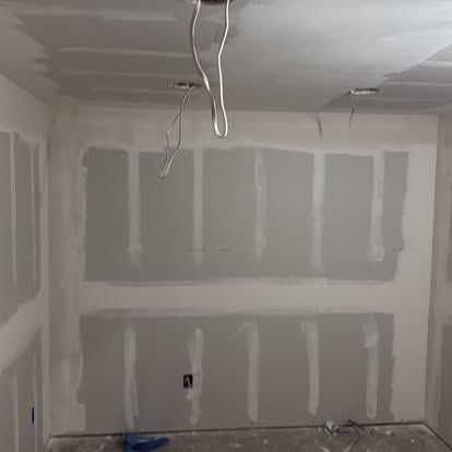 Drywall repaired and finished in a remodeled room