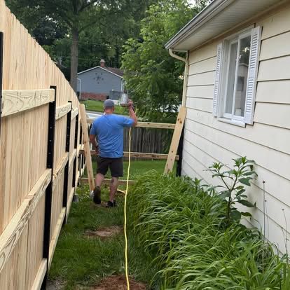 A Hughes Residential Services job site in the Metro East, building a privacy fence